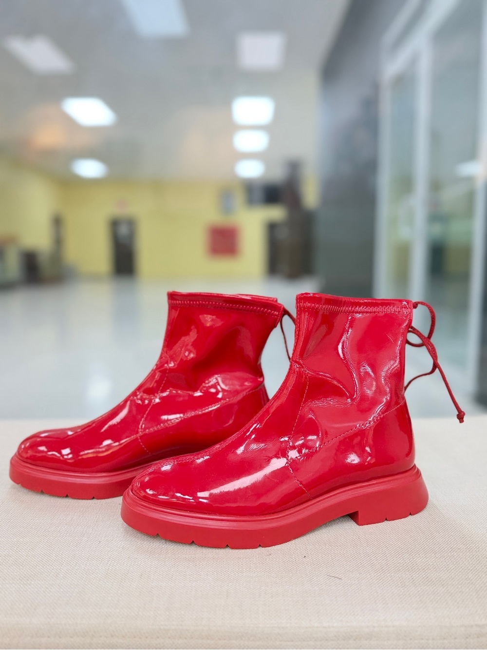 Glossy red Stuart Weitzman Benita Flat Vinyl Boots Women 6